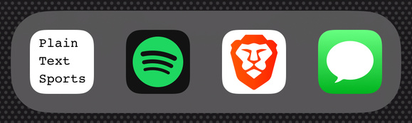 Plain Text Sports sitting in the iOS dock along with Brave.
